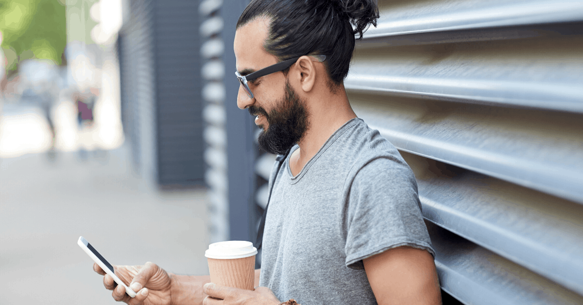 man looking at side job apps on his phone