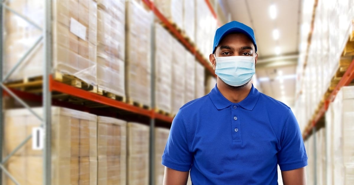 warehouse employee wearing a mask