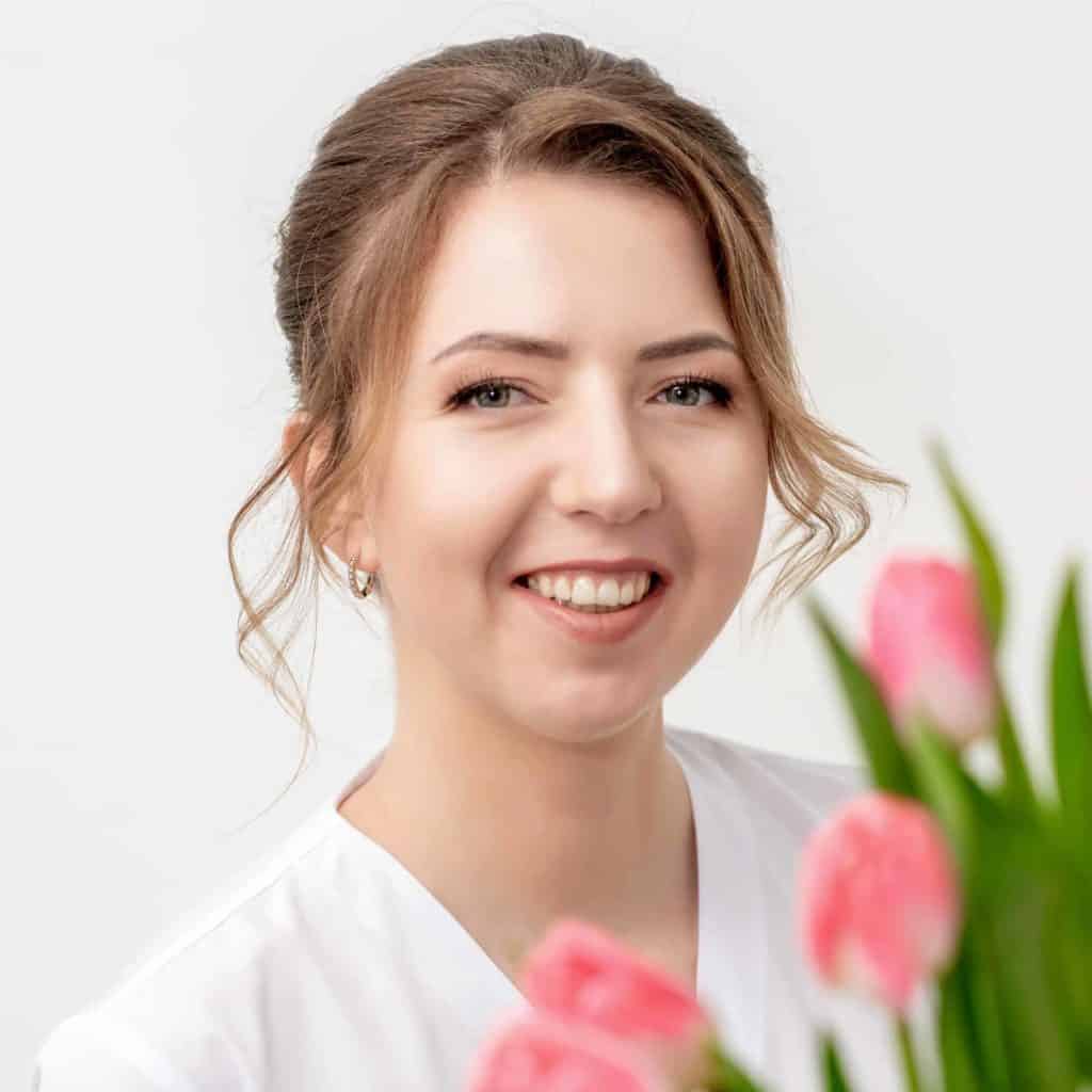 portrait-happy-young-caucasian-woman-with-pink-tulips-against-white-background-1024x1024